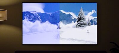 Imagine cu un ecran pe care se afișează o scenă montană de iarnă, demonstrând beneficiile senzorului de lumină și culoare
