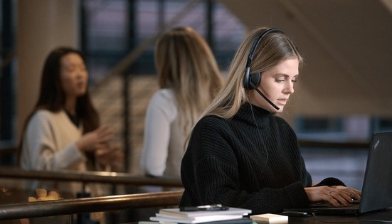 adapt-100---student-studying-wearing-headset